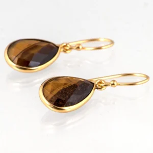 Verguld zilveren oorbellen tijgeroog liggend